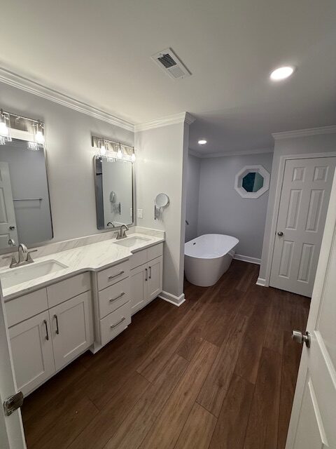 Custom bathroom vanity and freestanding tub remodel by JCAR Builders