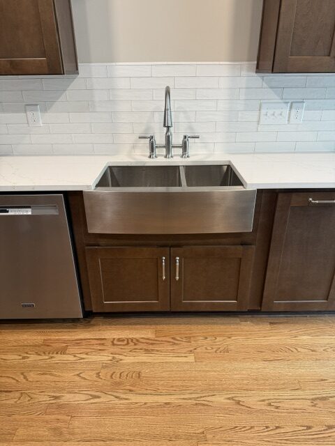 Kitchen remodeling Clayton NC project with farmhouse sink and custom cabinetry