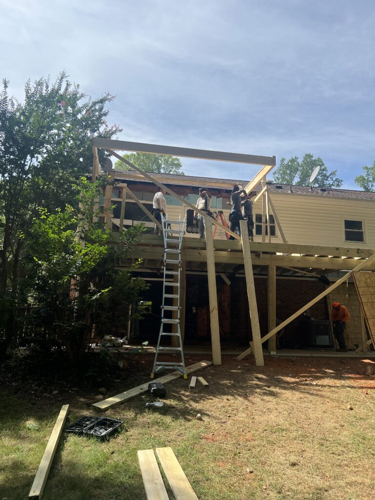 Framing underway for a Raleigh NC screened porch and deck addition